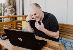 Jordan works on his laptop.