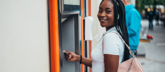 Woman using an ATM machine