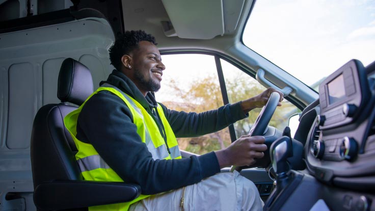 Man driving a commercial vehicle.