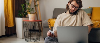 Man using his credit card online.